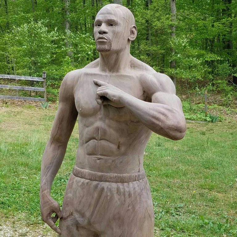 Sculptor Creates LifeSize Statues of Famous Athletes Out of Tree Trunk